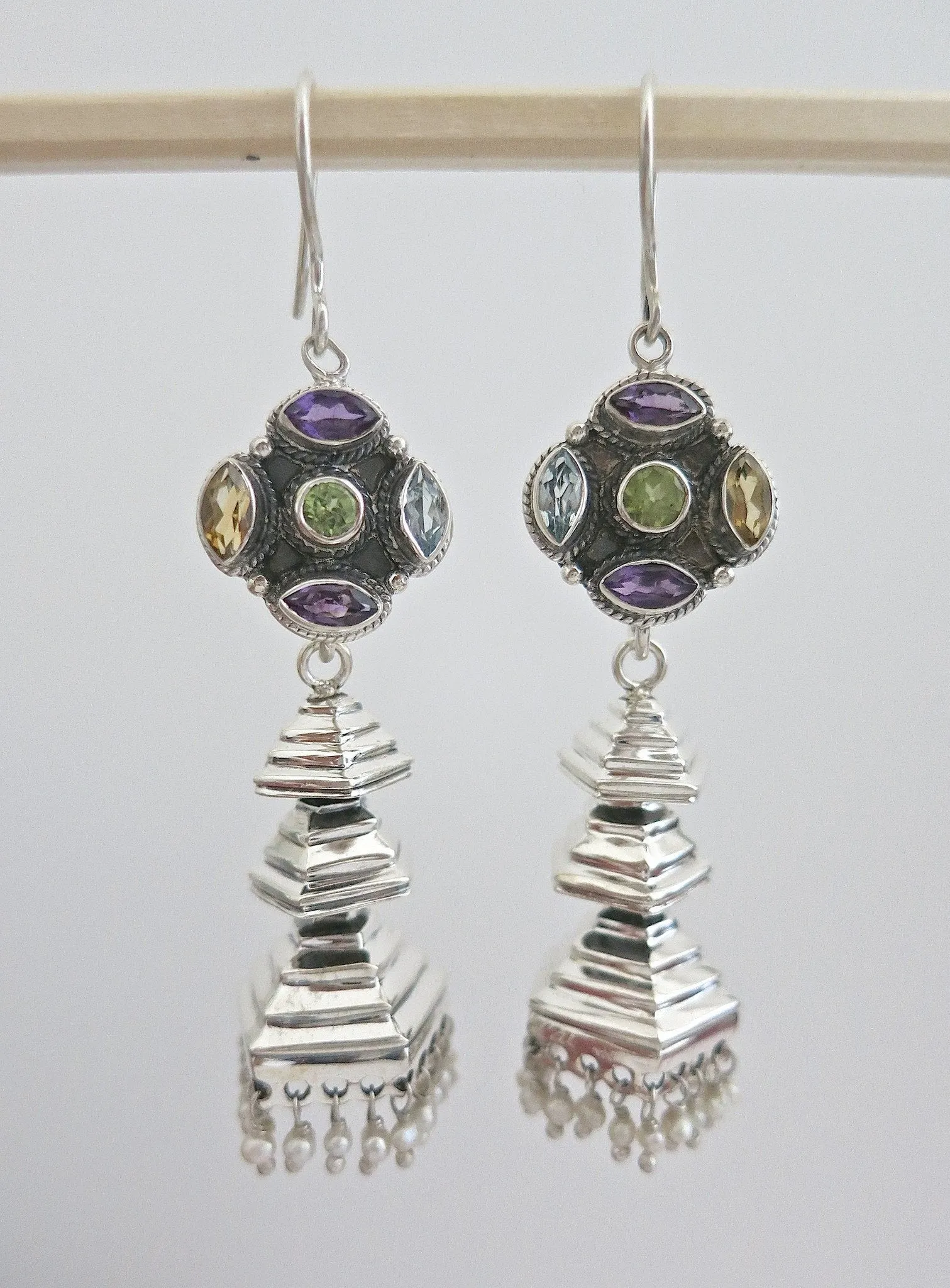 Contemporary, detachable, tiered jhumkas with multi-color gemstone tops